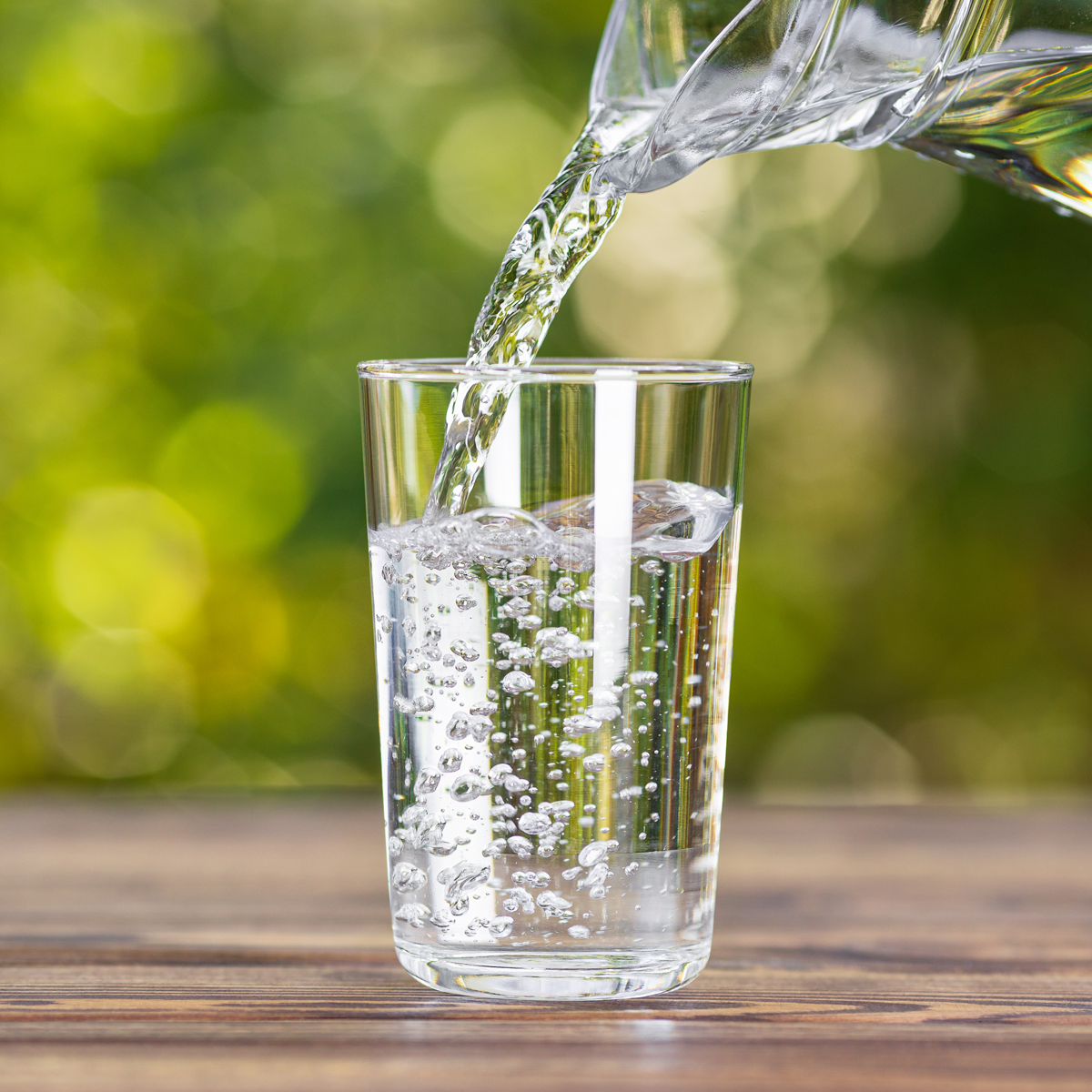 pouring glass of clean water